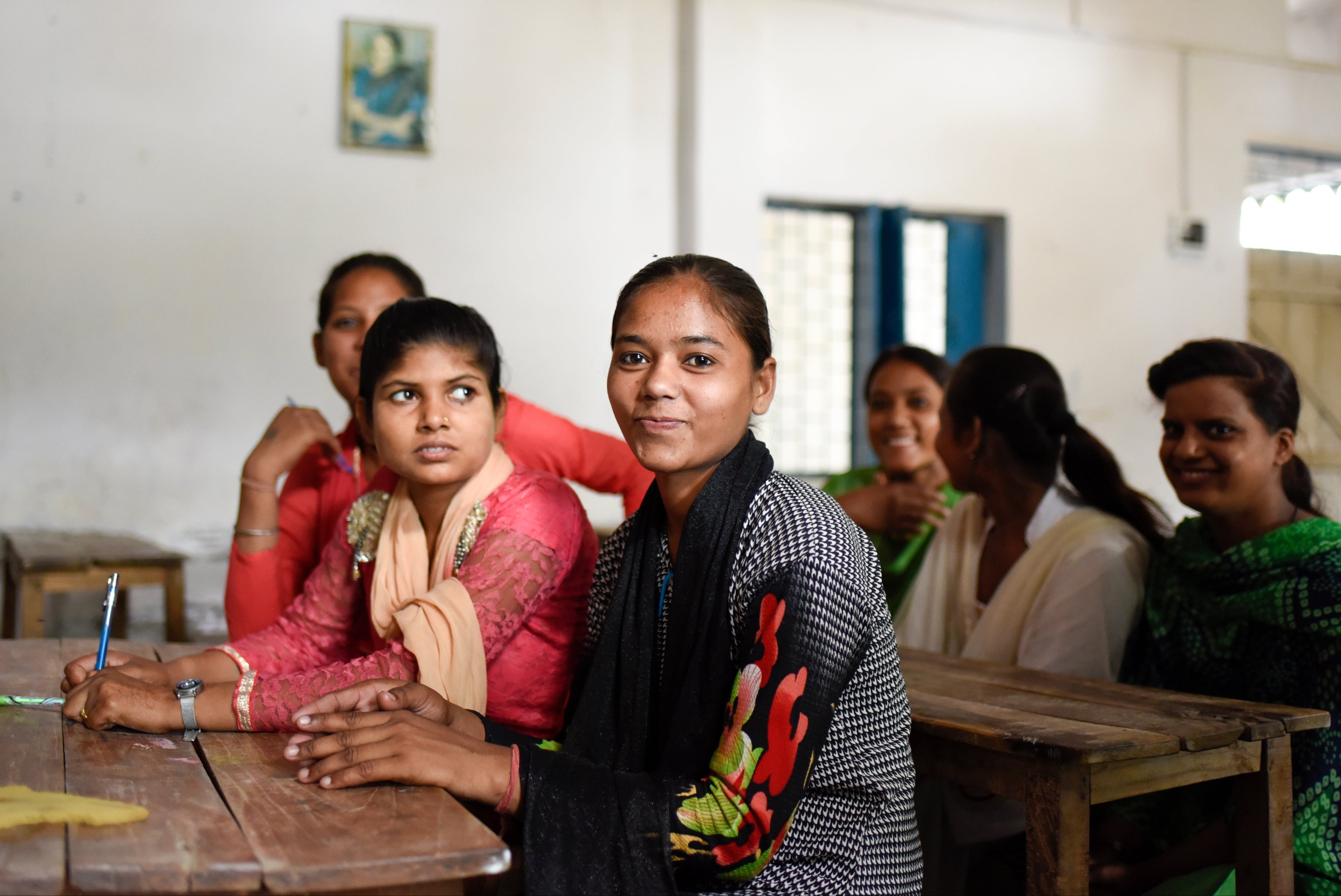 Group of students sitting at desks in a classroom